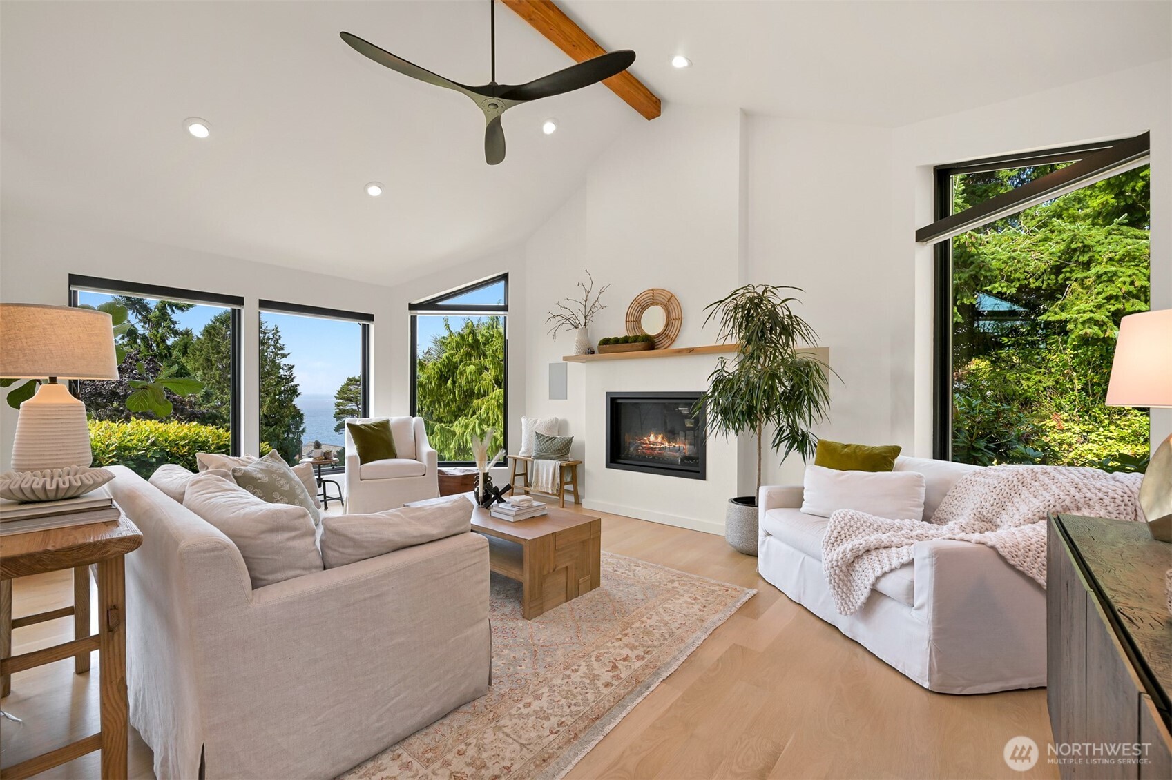 405 Bayside Road Bellingham, WA 98225 - Photo 9 of 40 a living room with furniture fireplace and a large window