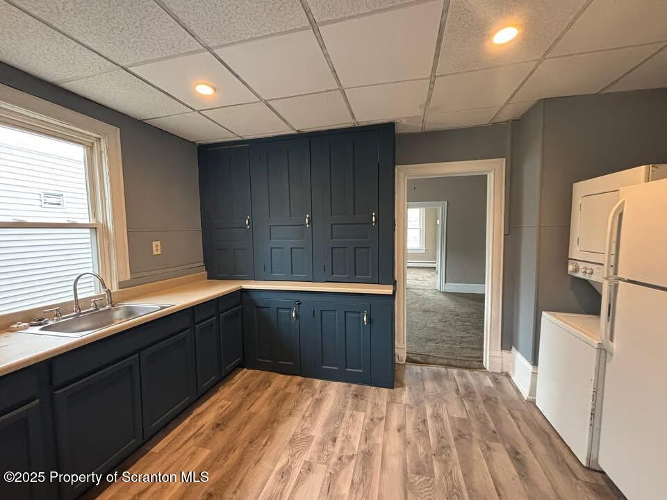 210 Center Street, Unit 2 Clarks Summit, PA 18411 - Photo 2 of 14 a kitchen with stainless steel appliances a sink cabinets and wooden floor