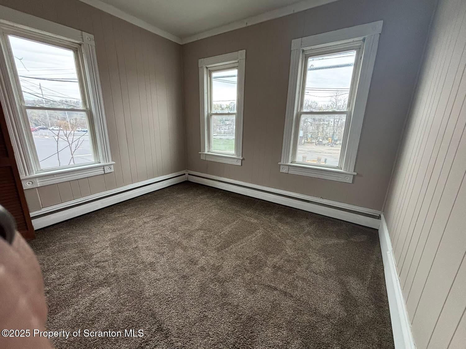 210 Center Street, Unit 2 Clarks Summit, PA 18411 - Photo 3 of 14 an empty room with a window