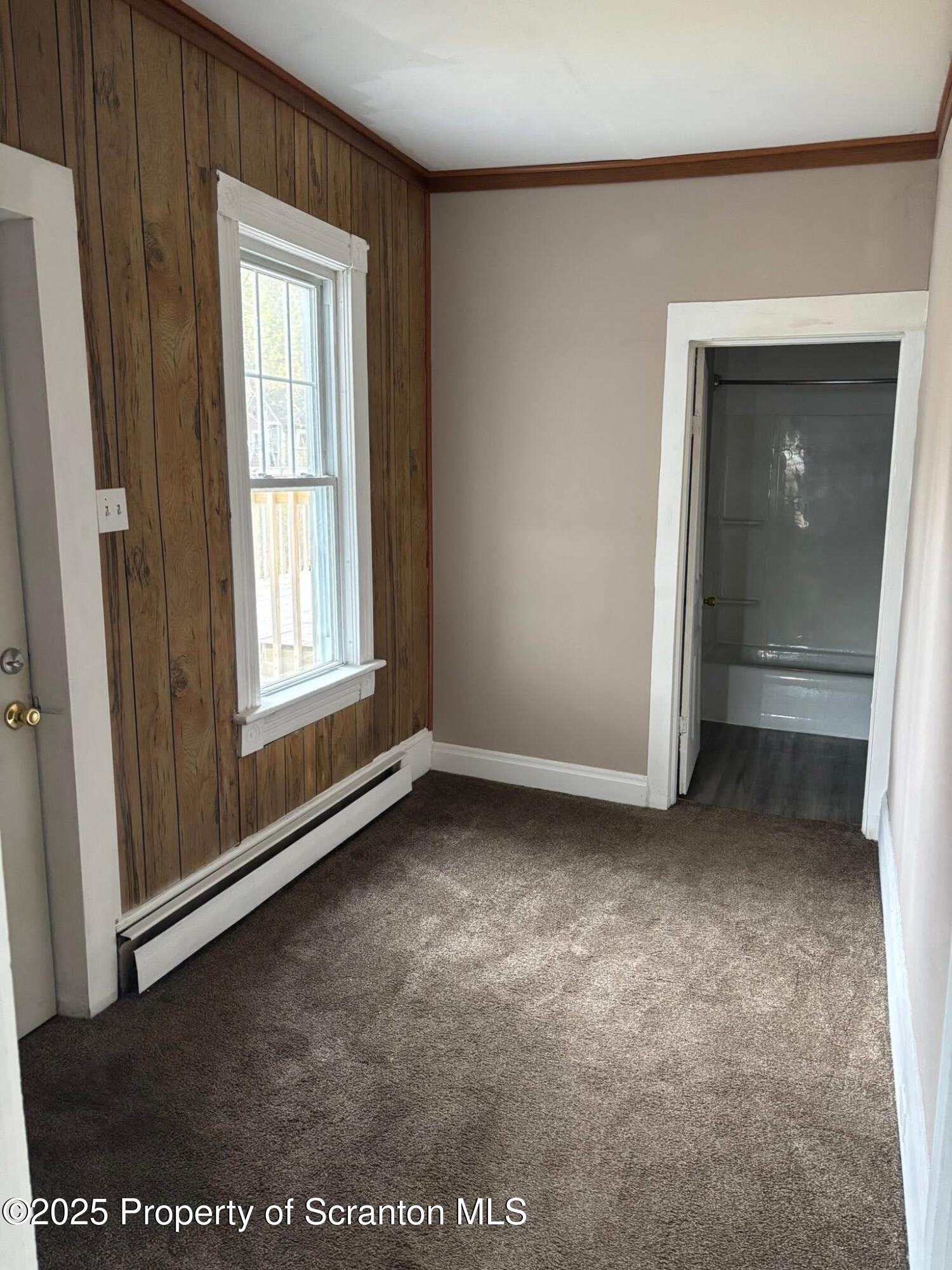 210 Center Street, Unit 2 Clarks Summit, PA 18411 - Photo 6 of 14 an empty room with windows