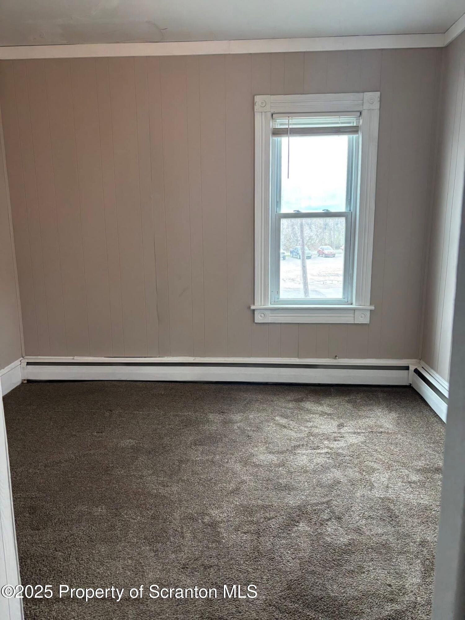 210 Center Street, Unit 2 Clarks Summit, PA 18411 - Photo 7 of 14 an empty room with a window