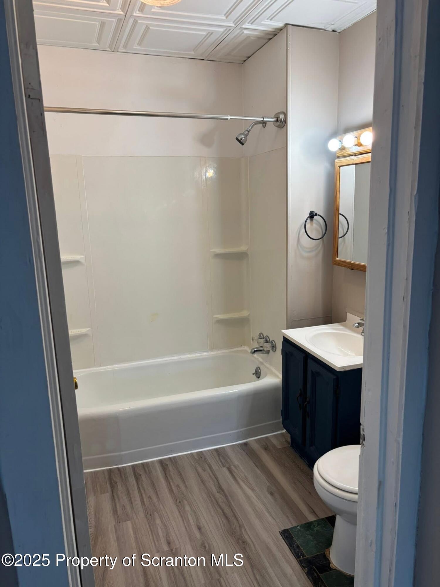 210 Center Street, Unit 2 Clarks Summit, PA 18411 - Photo 8 of 14 a bathroom with a sink a toilet and shower