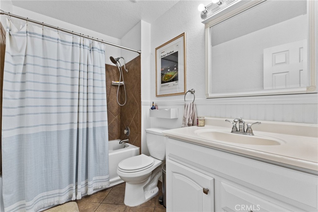 10151 Arrow Route, Unit 6 Rancho Cucamonga, CA 91730 - Photo 11 of 24 a bathroom with a sink a toilet and shower