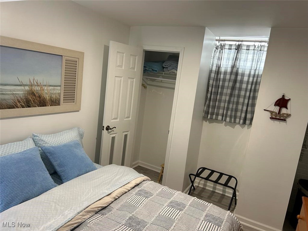 180 Elizabeth Parkway Akron, OH 44304 - Photo 13 of 46 Bedroom with closet in lower level - finished 2023