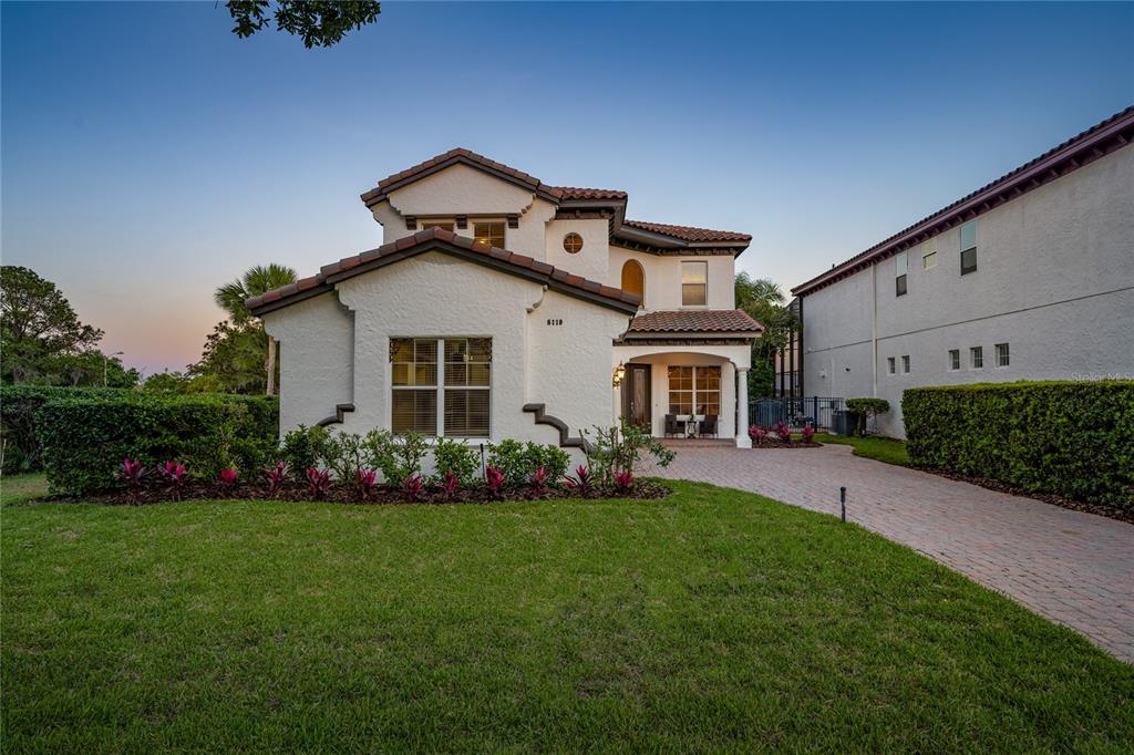 8119 Vía Rosa Orlando, FL 32836 - Photo 58 of 62 a front view of a house with a garden