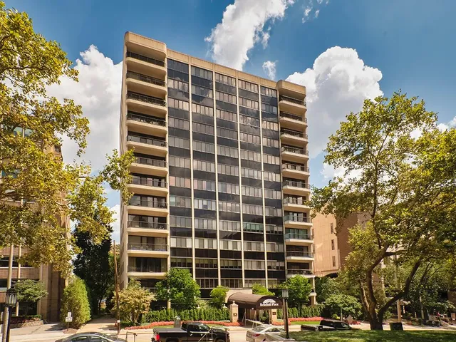 a front view of a building with street view