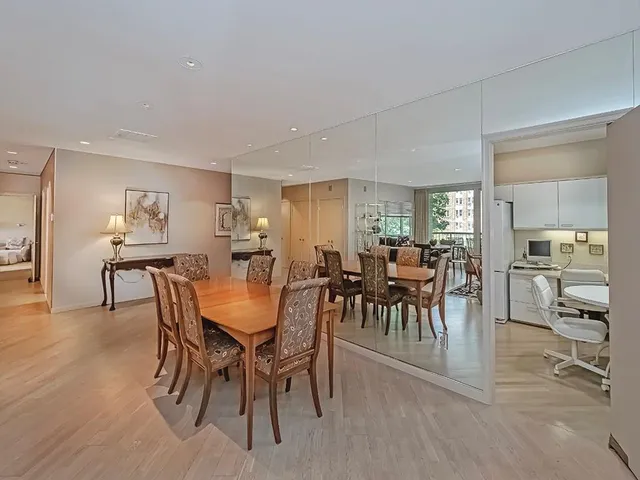 a view of a dining room with furniture and a livingroom
