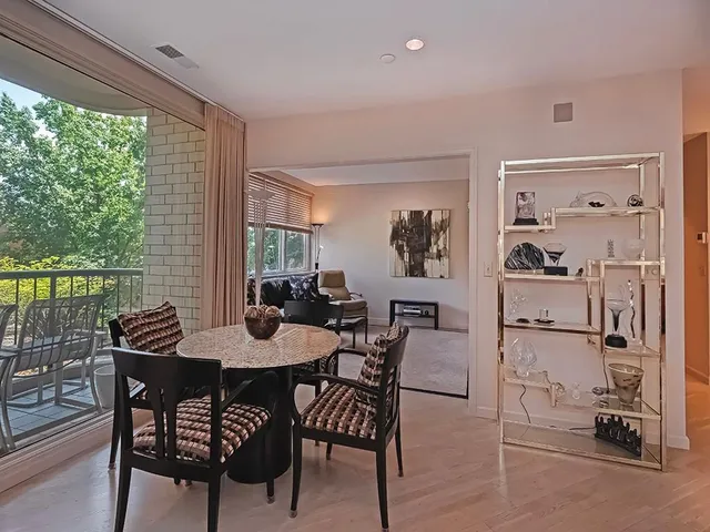 a dining room with furniture and window