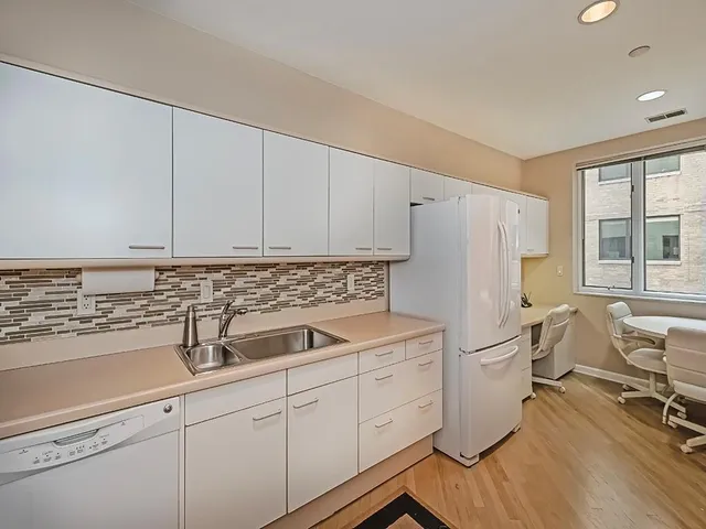 a kitchen with a stove and a refrigerator