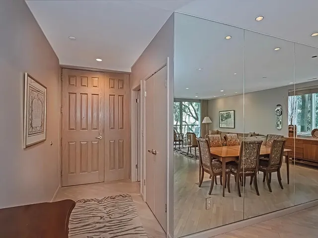 a view of a a dining room with furniture window and outside view