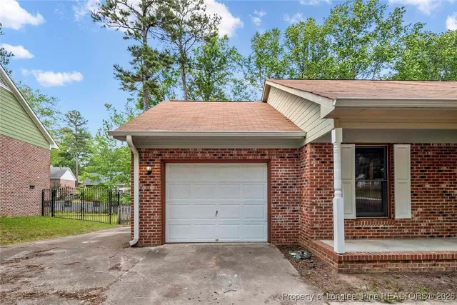 a view of house with outdoor space and parking space