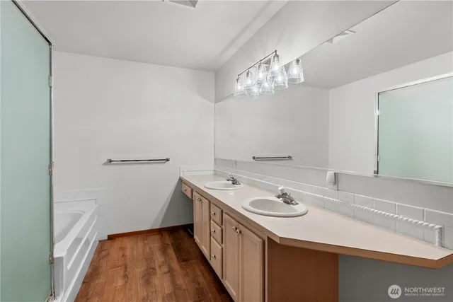 a bathroom with a sink a vanity and a mirror