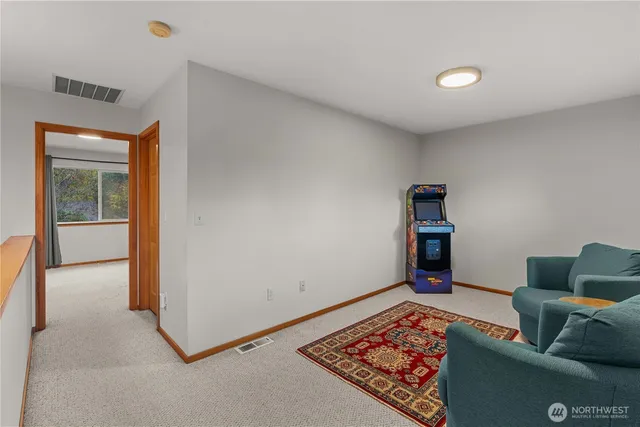 a living room with furniture and a rug