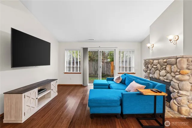 a living room with furniture and a flat screen tv