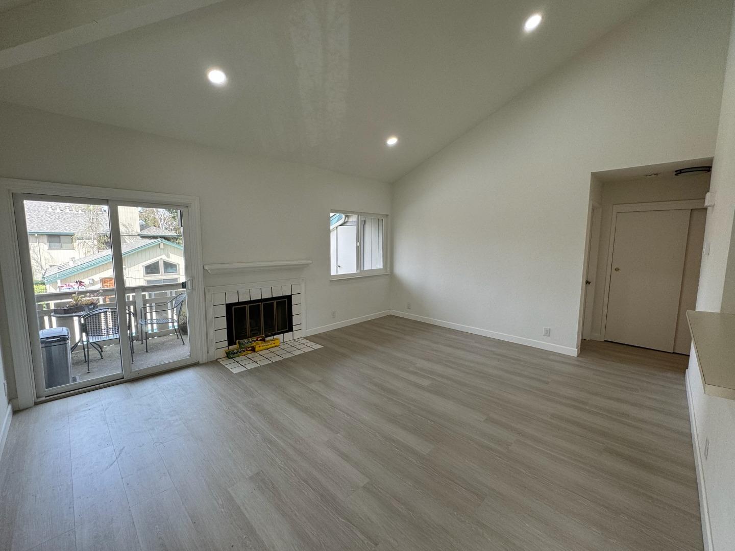 1460 Alma Loop San Jose, CA 95125 - Photo 1 of 14 a view of an empty room with wooden floor and a window