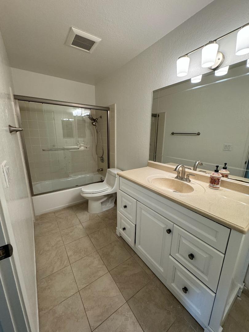 1460 Alma Loop San Jose, CA 95125 - Photo 11 of 14 a bathroom with a double vanity sink a toilet and a mirror