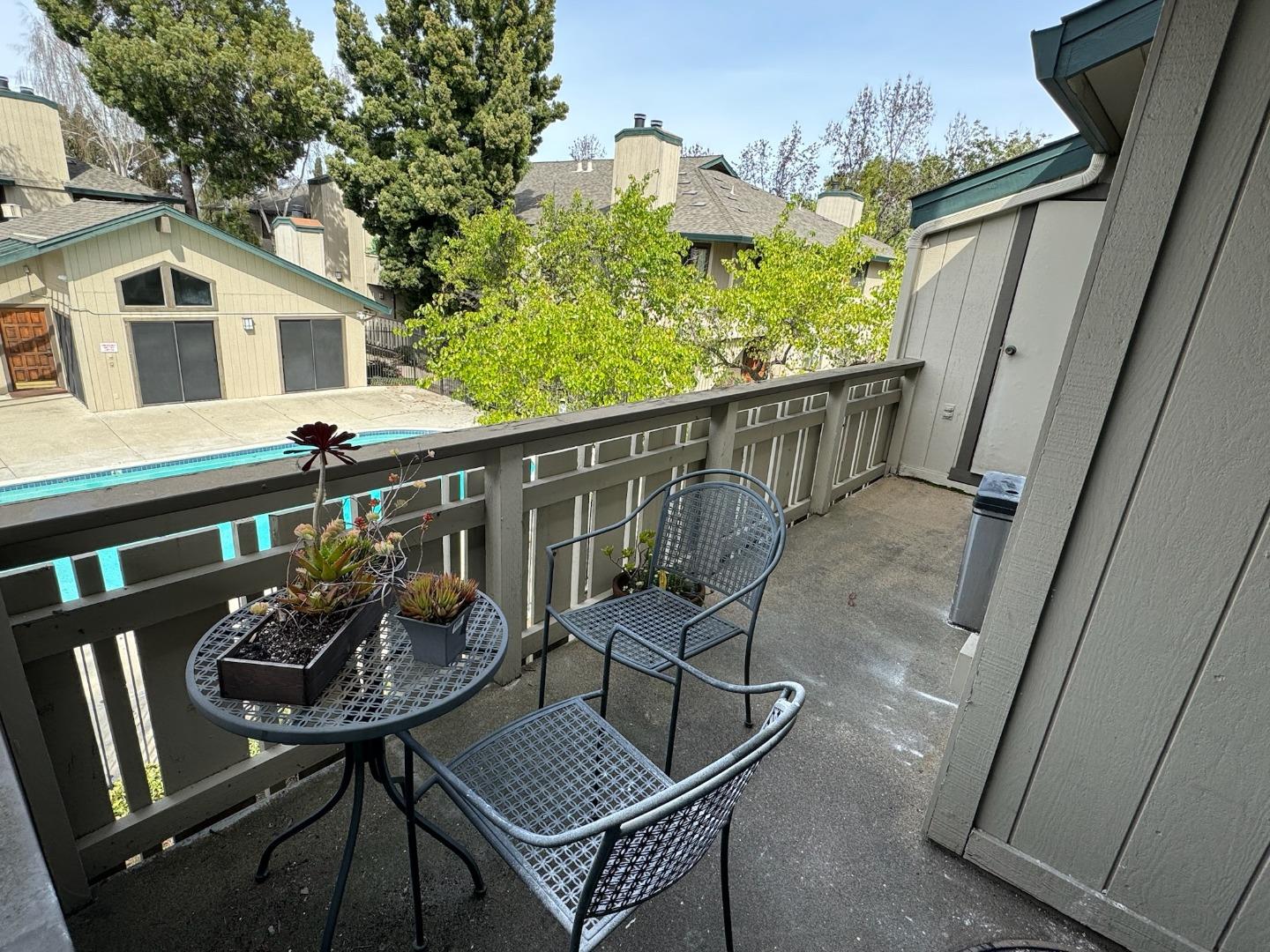 1460 Alma Loop San Jose, CA 95125 - Photo 14 of 14 a balcony with table and chairs