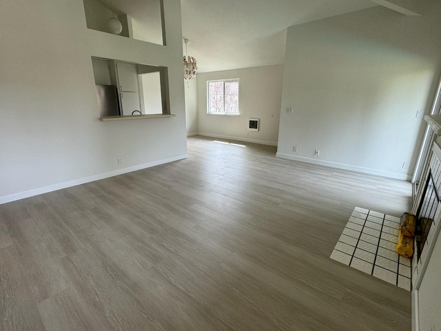 1460 Alma Loop San Jose, CA 95125 - Photo 2 of 14 an empty room with wooden floor and windows