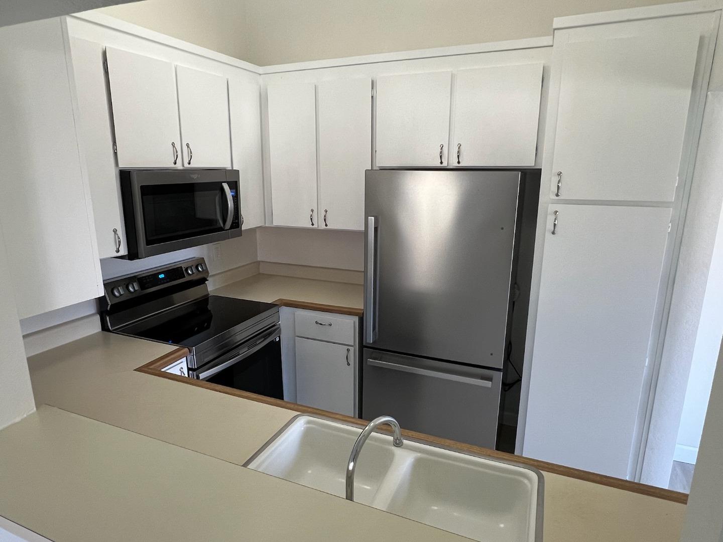 1460 Alma Loop San Jose, CA 95125 - Photo 5 of 14 a kitchen with a refrigerator and a stove