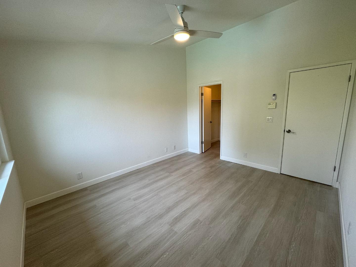 1460 Alma Loop San Jose, CA 95125 - Photo 9 of 14 an empty room with wooden floor and closet