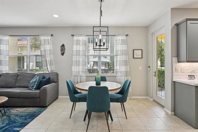 a dining room with furniture and window