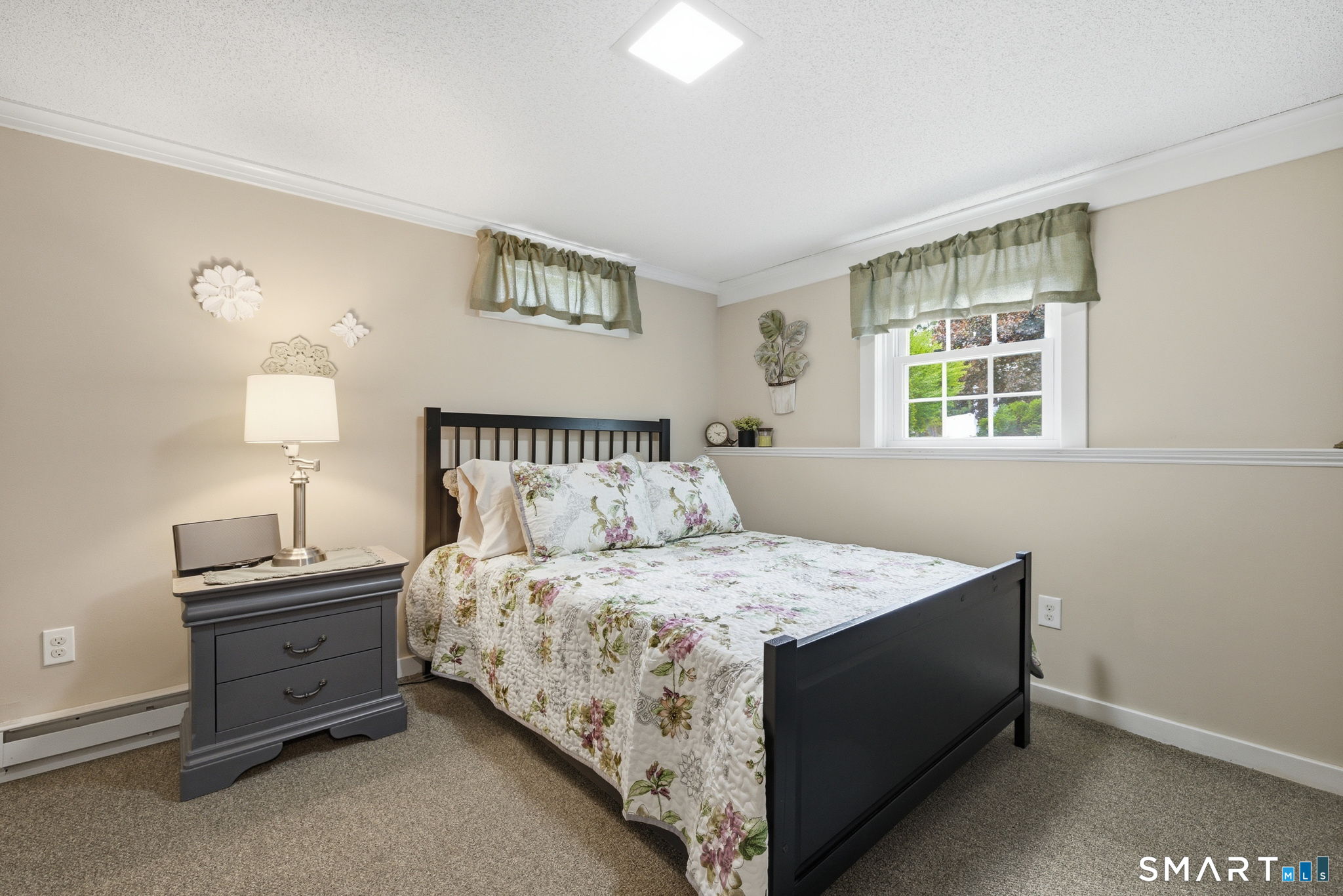 7 Stardust Drive Enfield, CT 06082 - Photo 23 of 38 a bedroom with a bed and a window