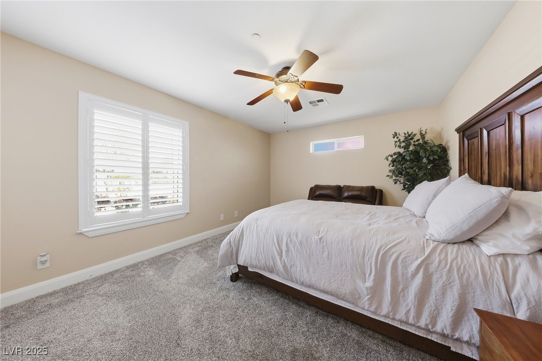 1285 Embry Avenue Moapa, NV 89025 - Photo 27 of 98 Bedroom featuring carpet flooring and a ceiling fan