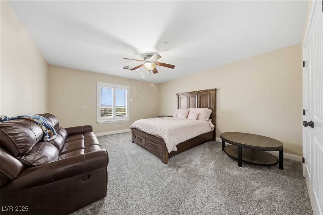 1285 Embry Avenue Moapa, NV 89025 - Photo 29 of 98 Bedroom with carpet flooring and a ceiling fan