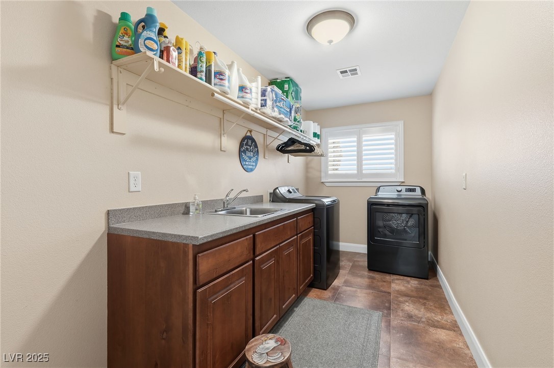 1285 Embry Avenue Moapa, NV 89025 - Photo 42 of 98 Washroom featuring independent washer and dryer and cabinet space