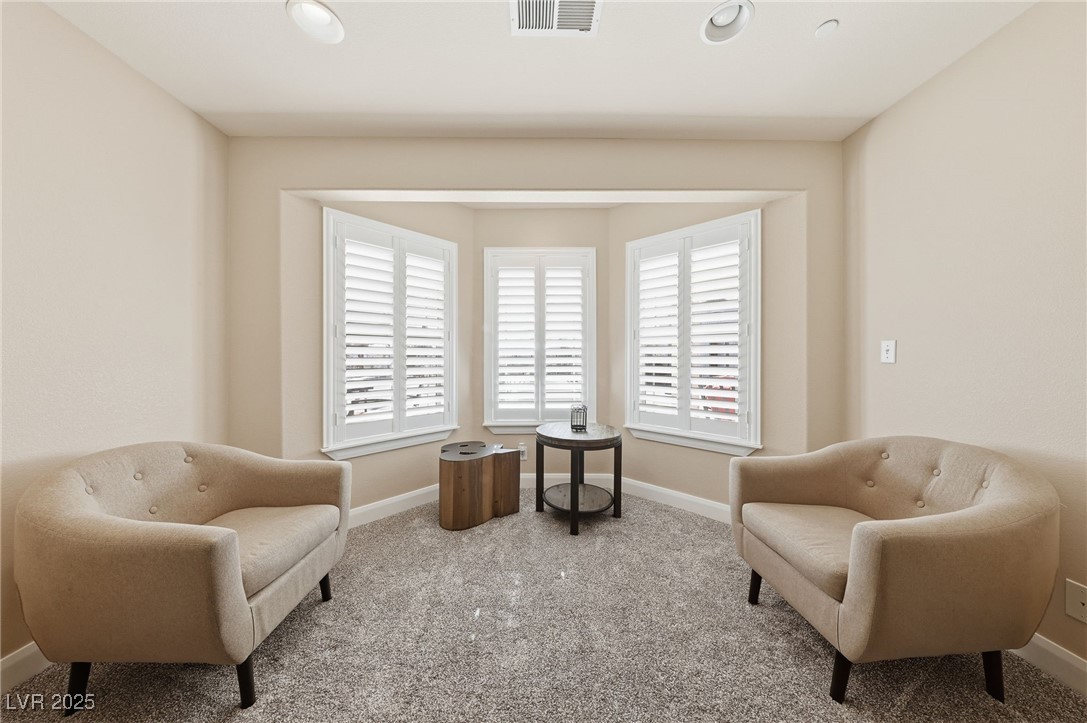 1285 Embry Avenue Moapa, NV 89025 - Photo 50 of 98 Living area featuring plenty of natural light and carpet floors