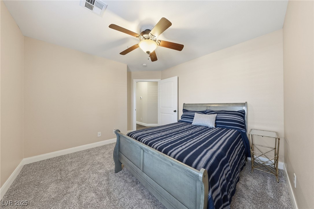 1285 Embry Avenue Moapa, NV 89025 - Photo 52 of 98 Bedroom with carpet flooring and ceiling fan