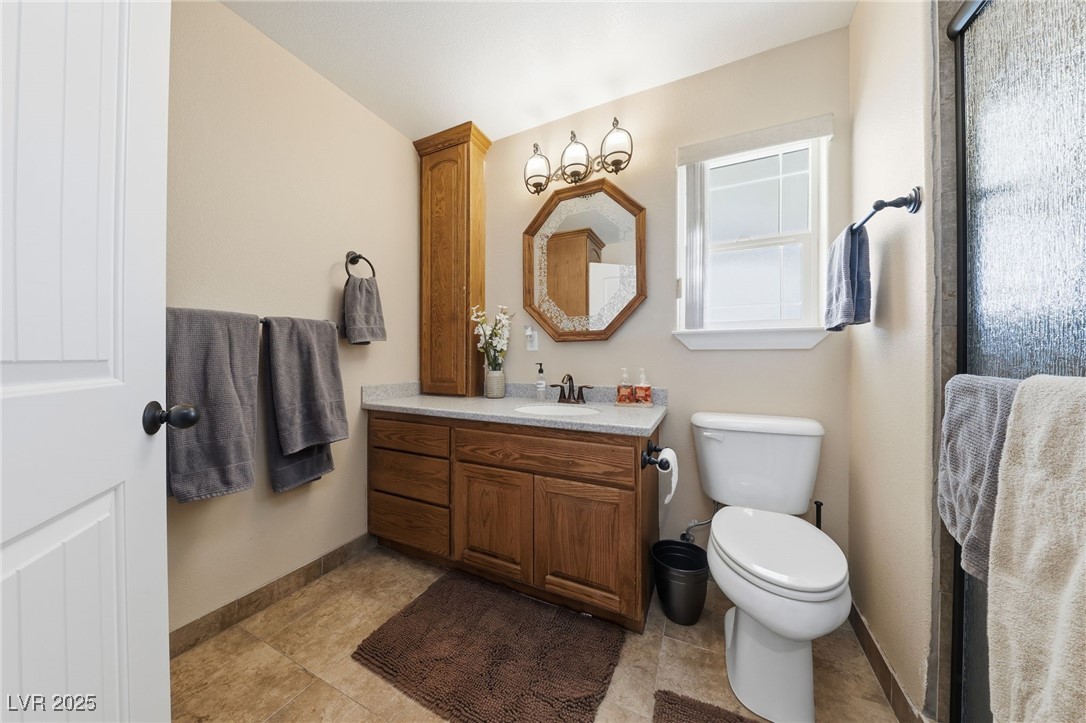 1285 Embry Avenue Moapa, NV 89025 - Photo 65 of 98 Full bathroom with vanity and baseboards