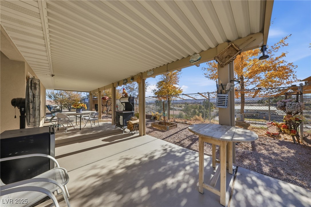 1285 Embry Avenue Moapa, NV 89025 - Photo 73 of 98 Fenced backyard with outdoor dining space and a patio