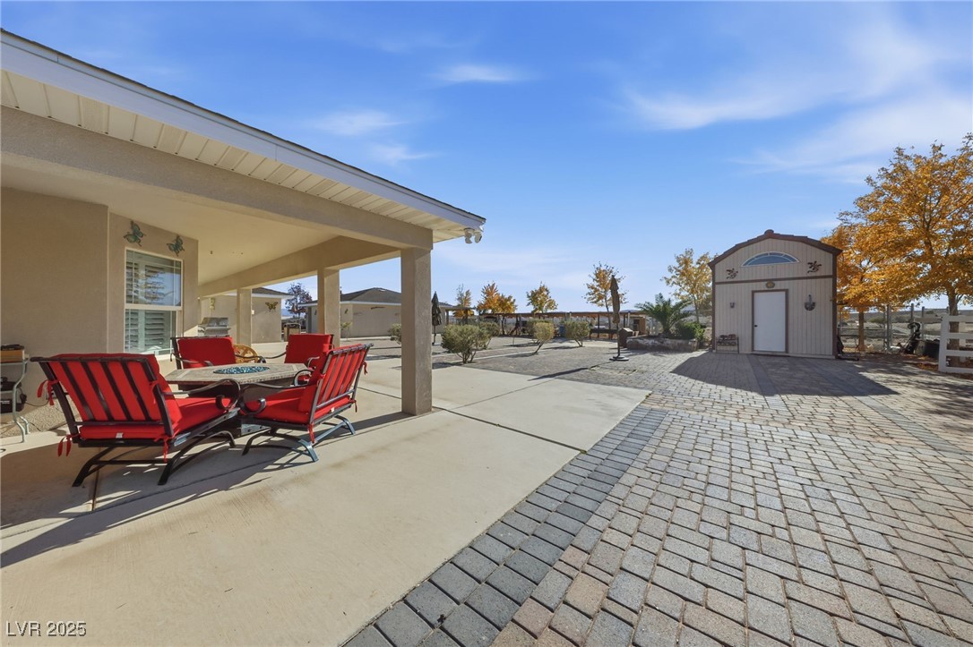 1285 Embry Avenue Moapa, NV 89025 - Photo 79 of 98 View of patio / terrace with outdoor dining space and an outdoor structure