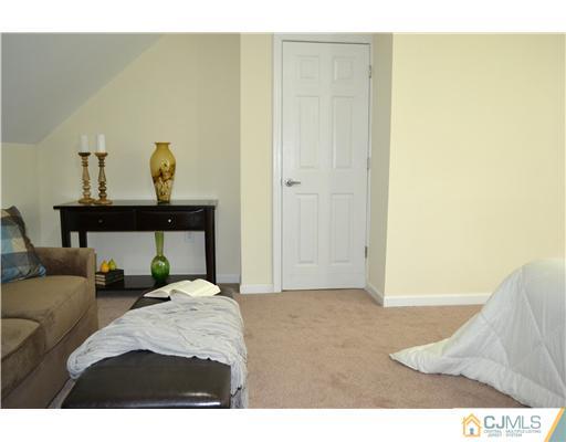 31 Montview Road Edison, NJ 08837 - Photo 14 of 25 a bedroom with a bed and teddy bear on bed