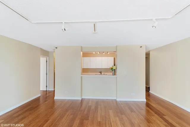 an empty room with wooden floor