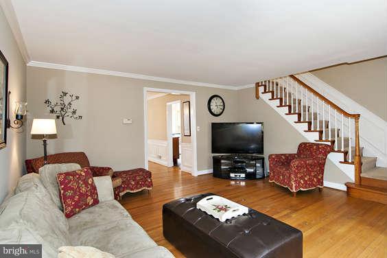 327 Whitfield Road Baltimore, MD 21228 - Photo 3 of 25 a living room with furniture and a flat screen tv