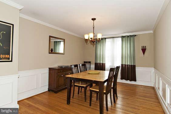 327 Whitfield Road Baltimore, MD 21228 - Photo 8 of 25 a view of a dining room with furniture window and wooden floor