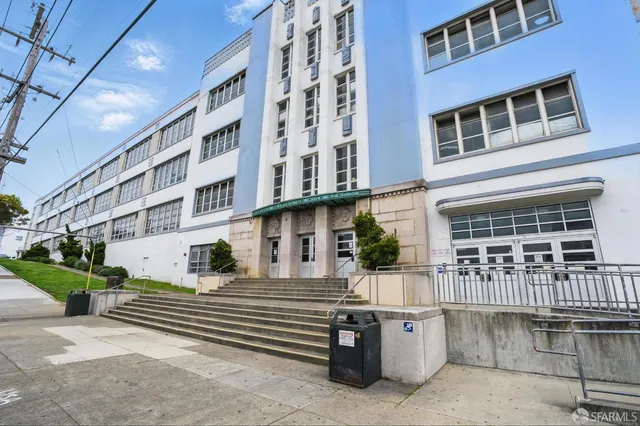 a front view of a building with a balcony