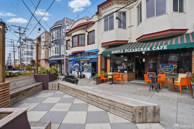 a view of a building with sitting area
