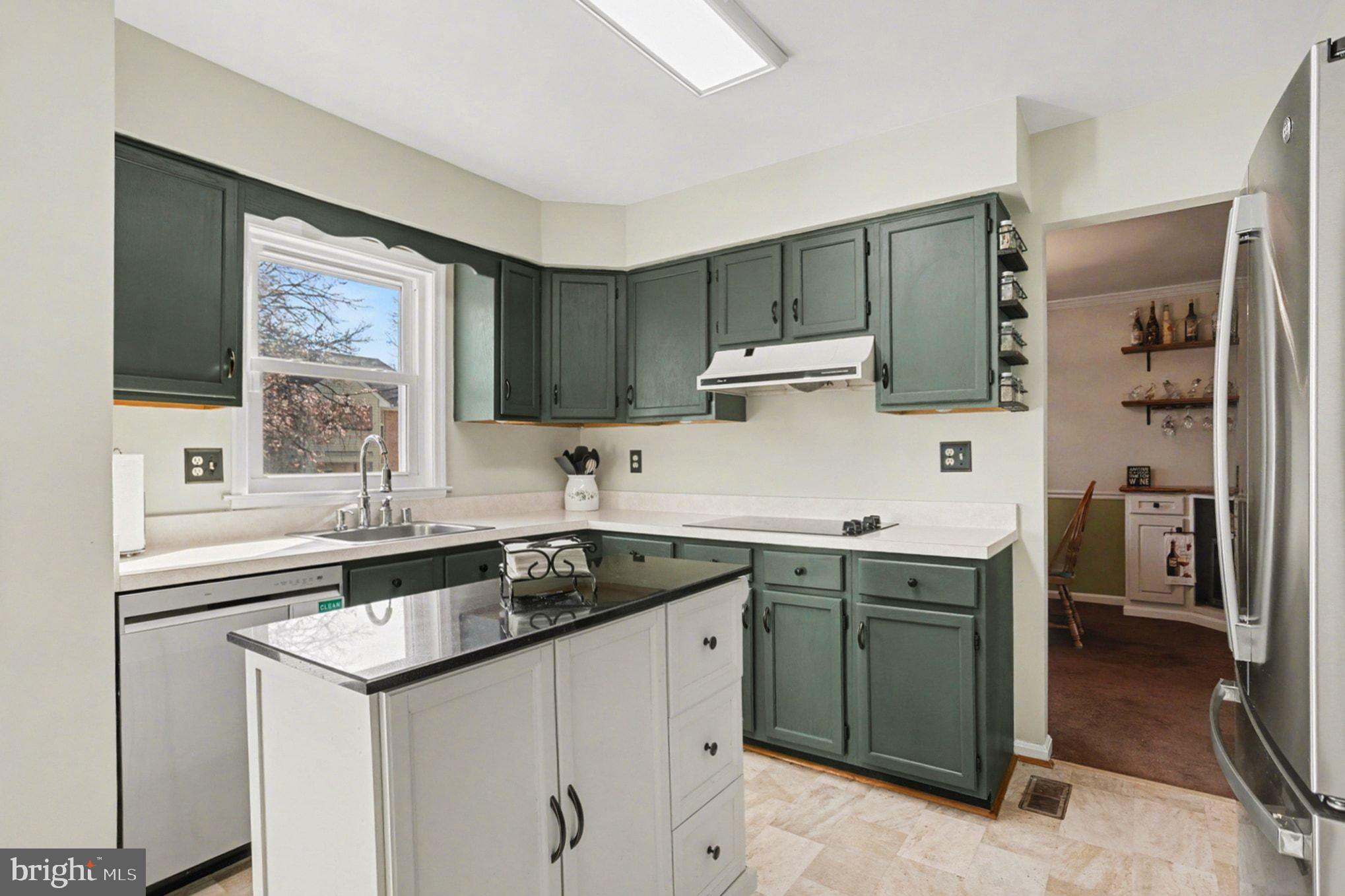 4400 Cottington Road Nottingham, MD 21236 - Photo 15 of 48 a kitchen with a sink stove and cabinets