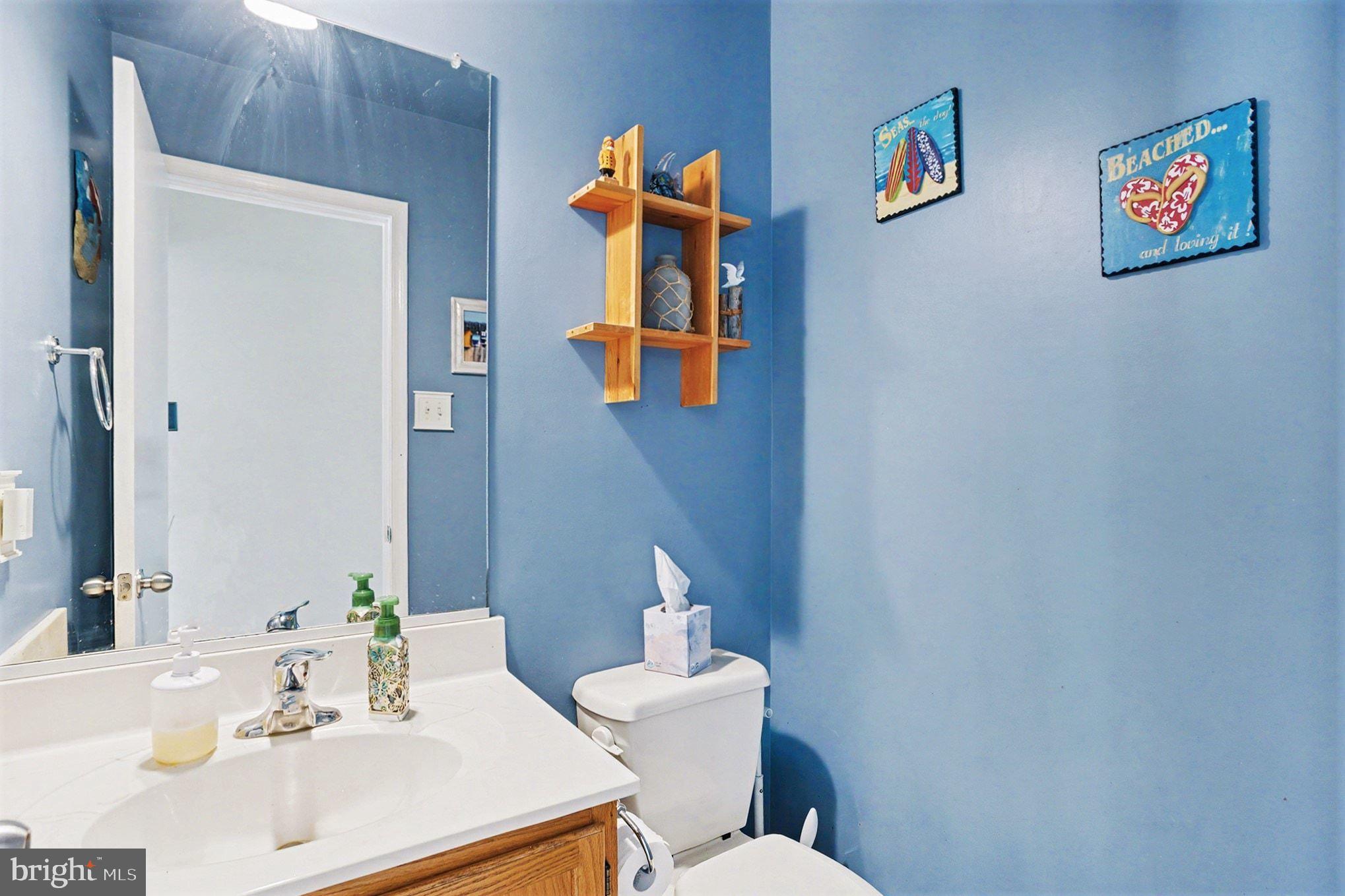 4400 Cottington Road Nottingham, MD 21236 - Photo 17 of 48 a bathroom with a sink and a mirror