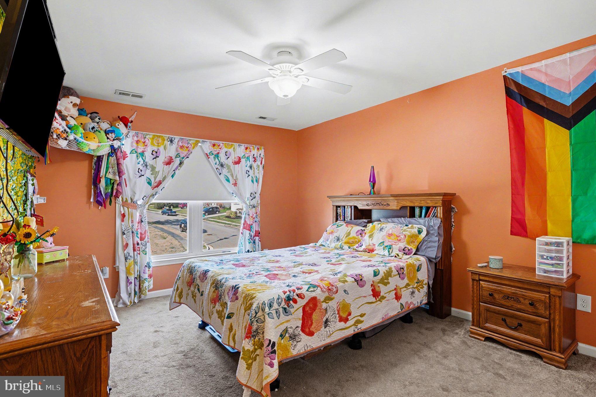 4400 Cottington Road Nottingham, MD 21236 - Photo 24 of 48 a bedroom with a bed and a flat tv screen on dresser