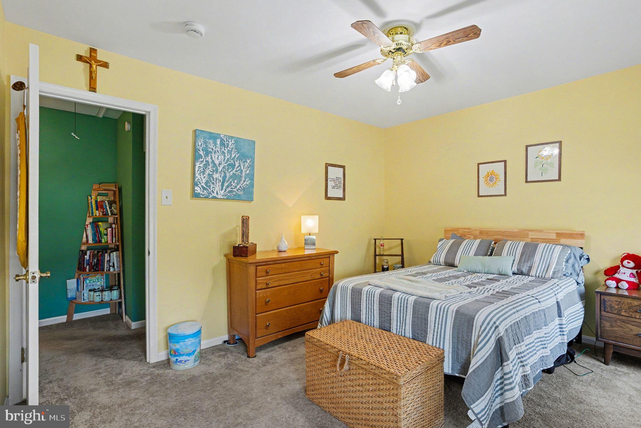 4400 Cottington Road Nottingham, MD 21236 - Photo 28 of 48 a bedroom with a bed and a chandelier