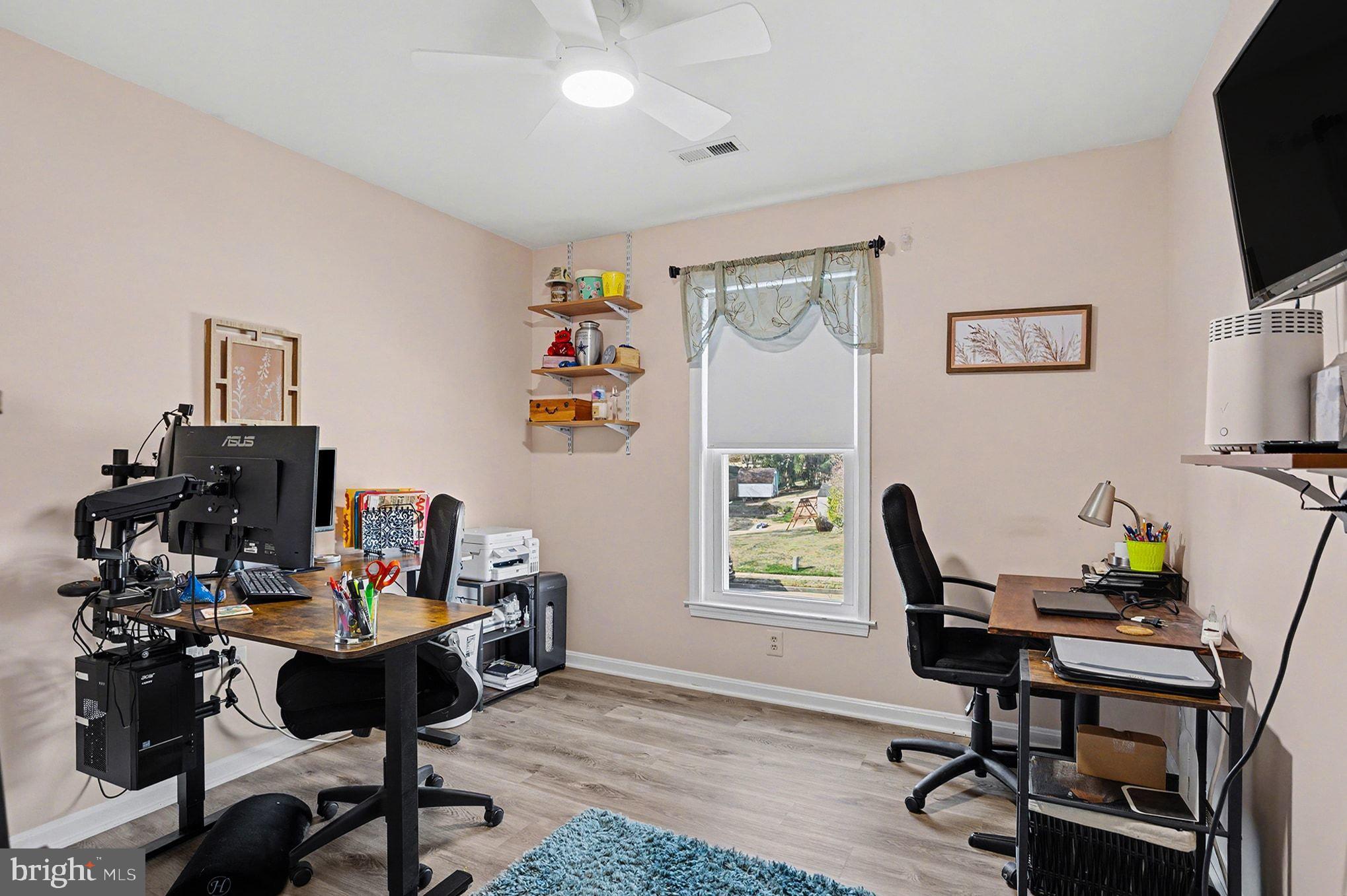 4400 Cottington Road Nottingham, MD 21236 - Photo 29 of 48 a view of a workspace with furniture and a window