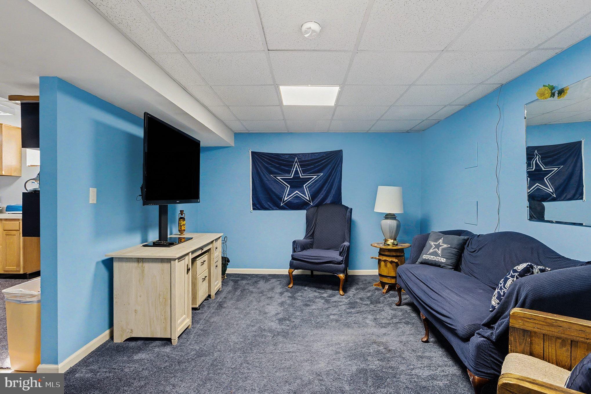 4400 Cottington Road Nottingham, MD 21236 - Photo 33 of 48 a living room with furniture and a flat screen tv