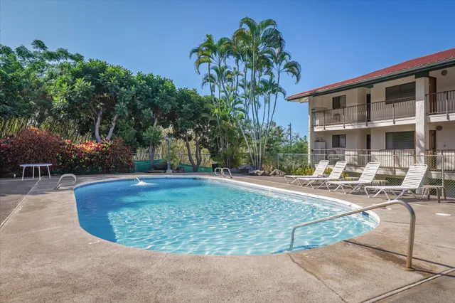 a front view of a building with sitting area