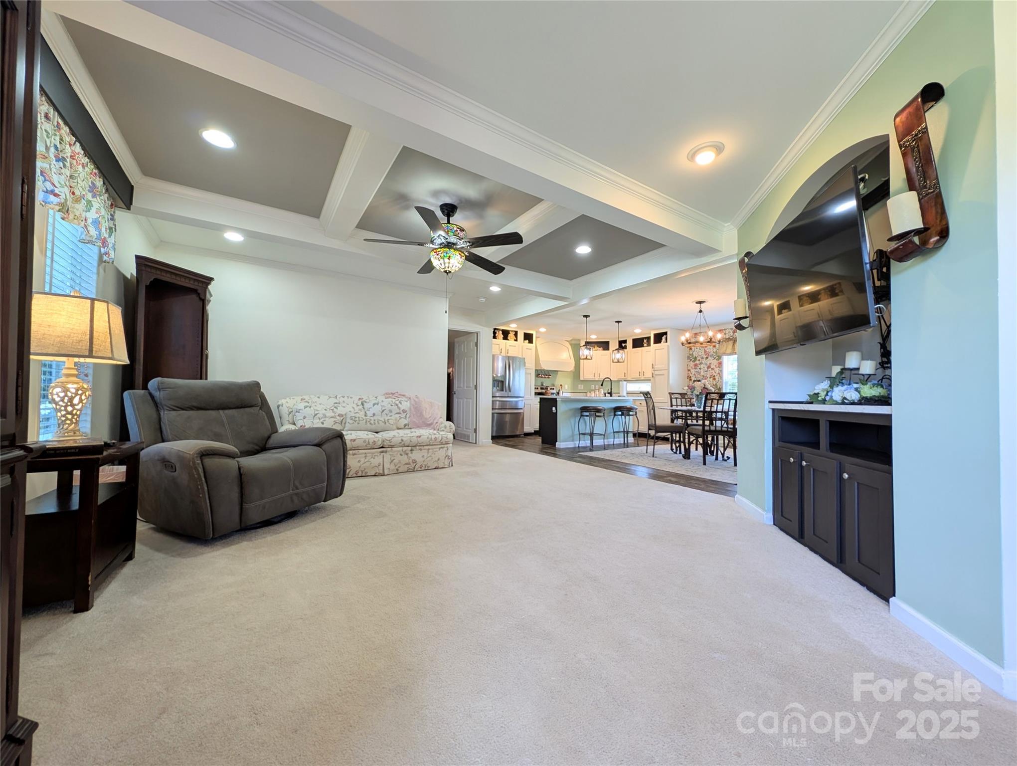 4713 White Store Road Wingate, NC 28174 - Photo 13 of 44 a living room with furniture and a flat screen tv