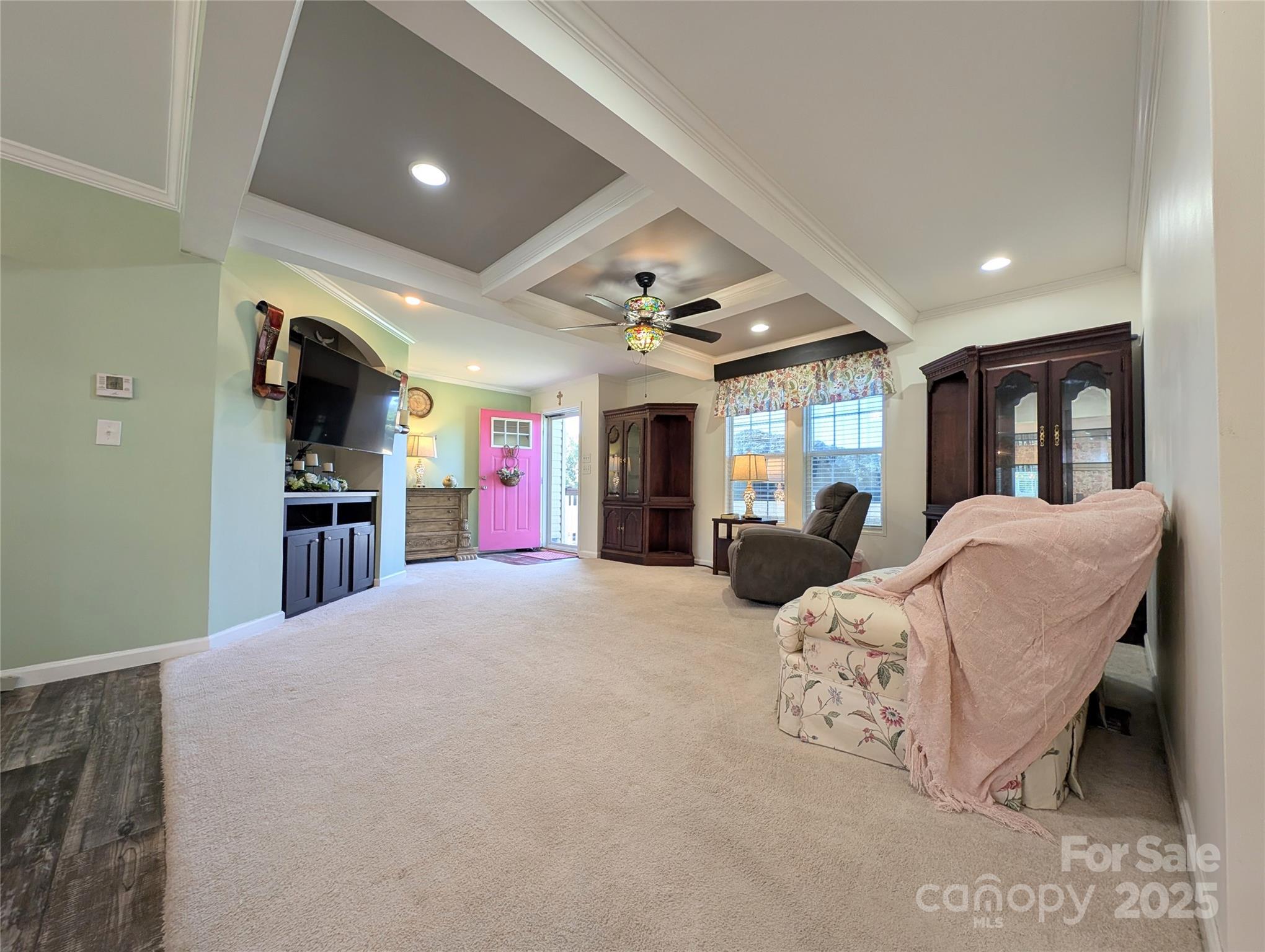 4713 White Store Road Wingate, NC 28174 - Photo 18 of 44 a living room with furniture and a flat screen tv