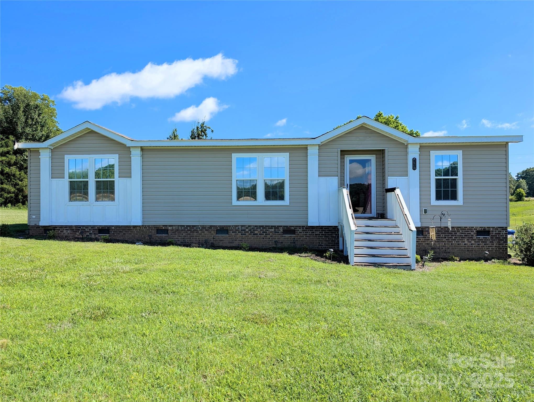 4713 White Store Road Wingate, NC 28174 - Photo 2 of 44 a front view of a house with a yard